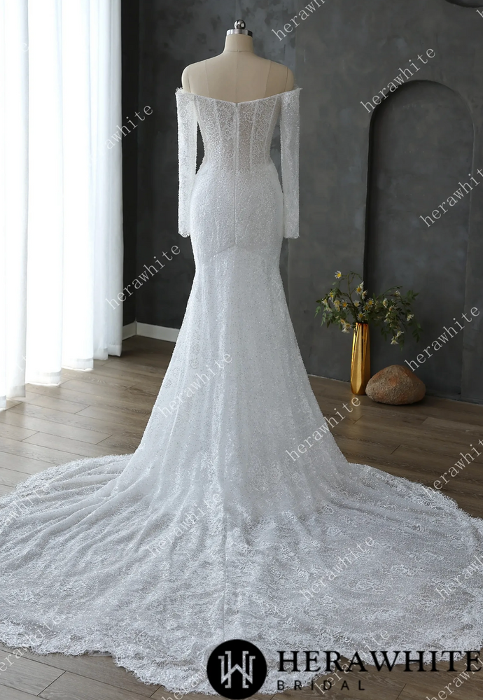 
                      
                        White lace wedding dress on a mannequin
                      
                    
