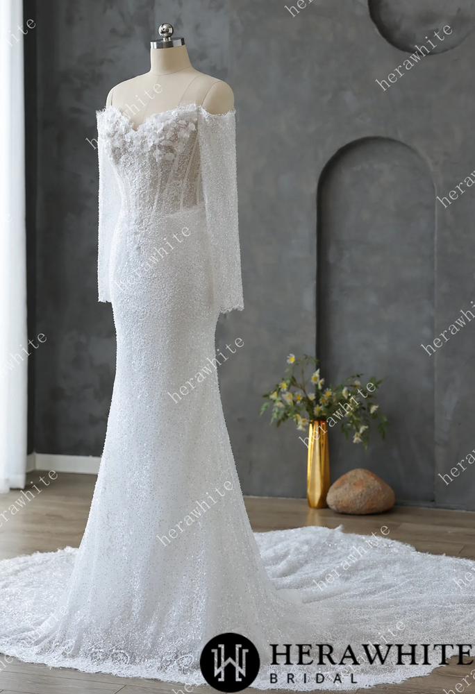 
                      
                        White lace wedding dress on a mannequin
                      
                    