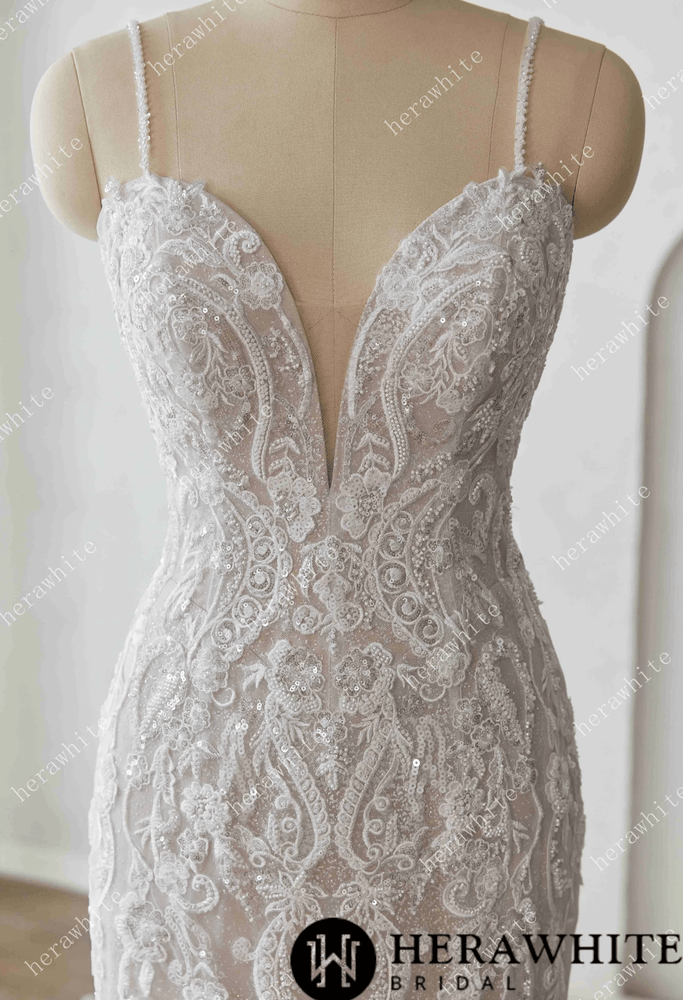 
                      
                        Elegant lace wedding dress on a mannequin against a white background with 'Herawhite Bridal' branding.
                      
                    