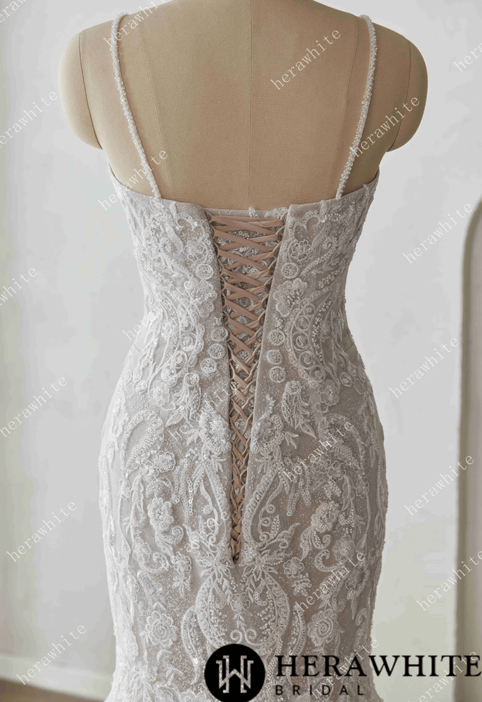 
                      
                        Elegant lace wedding dress on a mannequin against a white background with 'Herawhite Bridal' branding.
                      
                    