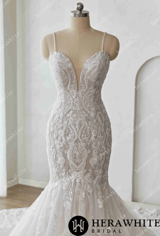 
                      
                        Elegant lace wedding dress on a mannequin against a white background with 'Herawhite Bridal' branding.
                      
                    
