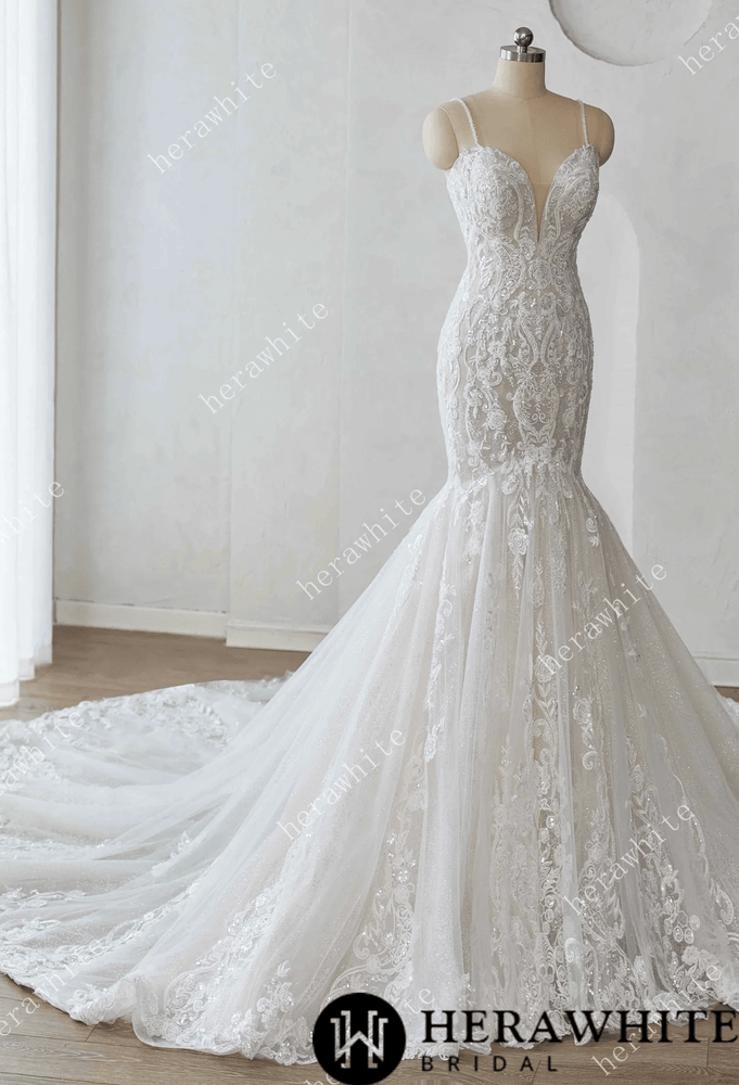
                      
                        Elegant lace wedding dress on a mannequin against a white background with 'Herawhite Bridal' branding.
                      
                    