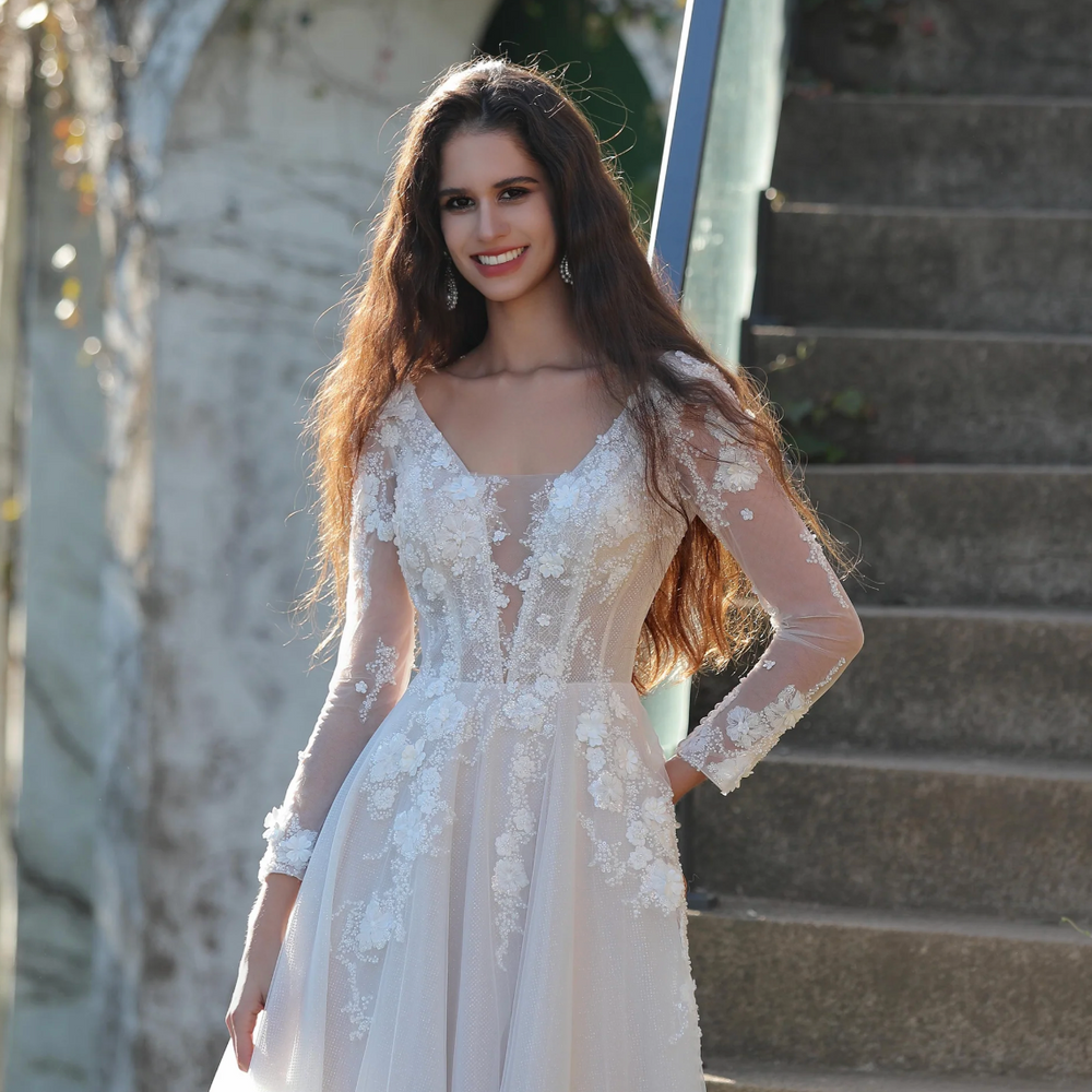 
                      
                        Ethereal Long-Sleeved A-Line Wedding Gown With Intricate Floral Embroidery
                      
                    