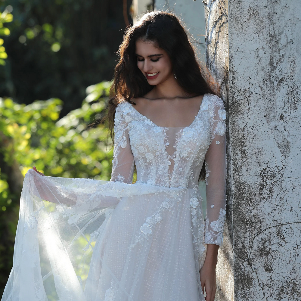 
                      
                        Ethereal Long-Sleeved A-Line Wedding Gown With Intricate Floral Embroidery
                      
                    