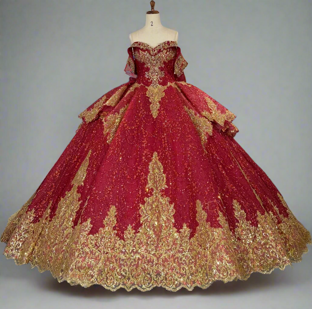 Red and gold ball gown on a mannequin in a store with other dresses in the background.