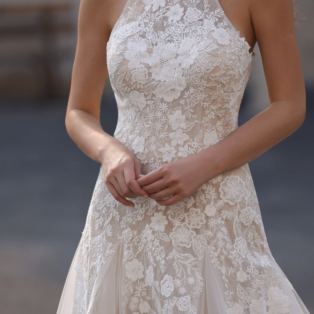 
                      
                        Lace dress worn by a model with a blurred background
                      
                    
