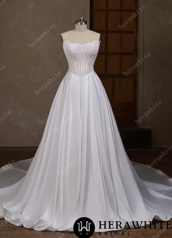 
                      
                        Satin Wedding Dress Irregular Neckline Basque Waistline Bridal Gown, this strapless wedding dress captivates with its distinctive irregular neckline
                      
                    