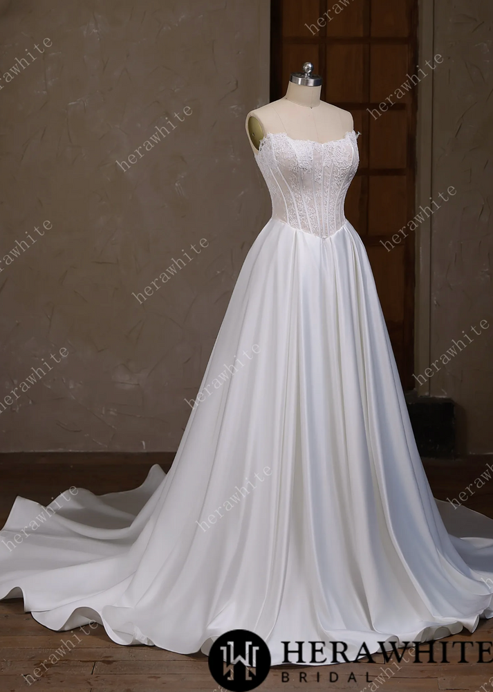 
                      
                        Satin Wedding Dress Irregular Neckline Basque Waistline Bridal Gown, this strapless wedding dress captivates with its distinctive irregular neckline
                      
                    
