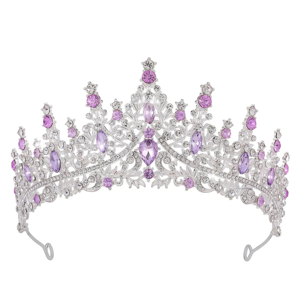 
                      
                        Silver tiara with purple gemstones on a white background
                      
                    