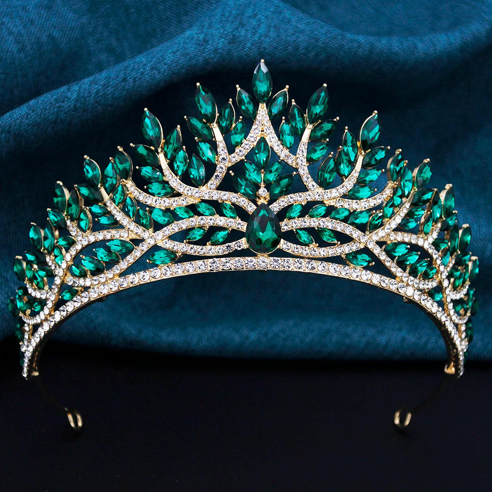 
                      
                        Green gemstone tiara on a dark blue fabric background
                      
                    