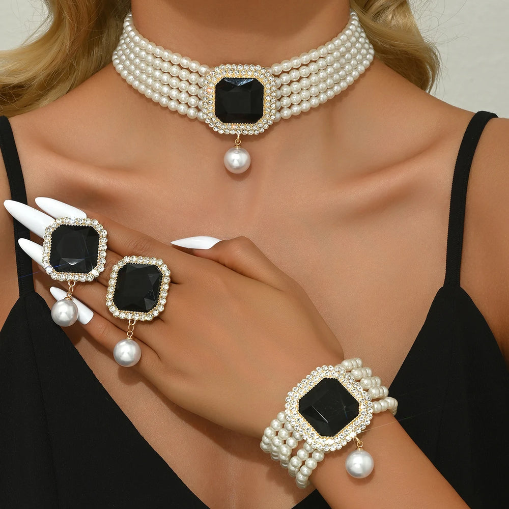 
                      
                        Pearl and black gemstone jewelry set 
                      
                    