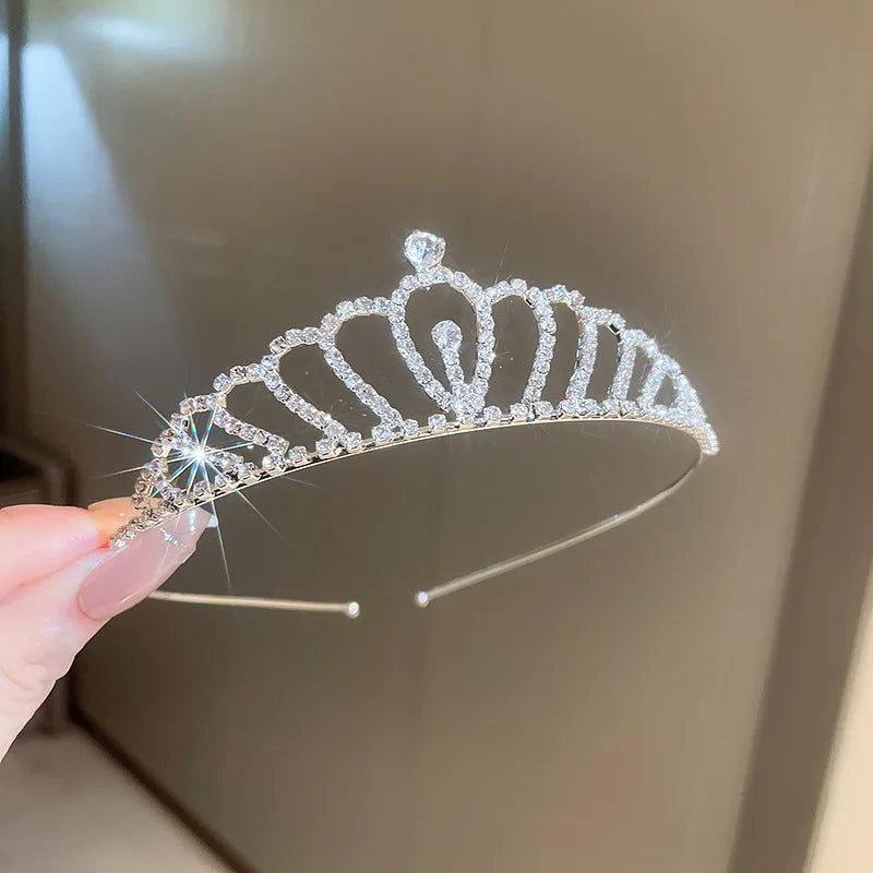 Girls princess tiara crowns in a variety of styles, crystal tiaras on metal frame, pageant, prom, party events.