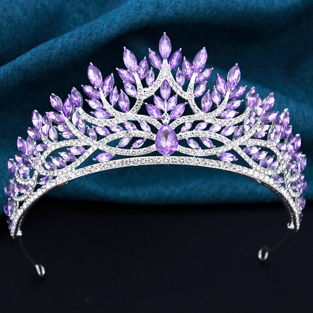 
                      
                        Purple tiara with crystals on a dark background
                      
                    