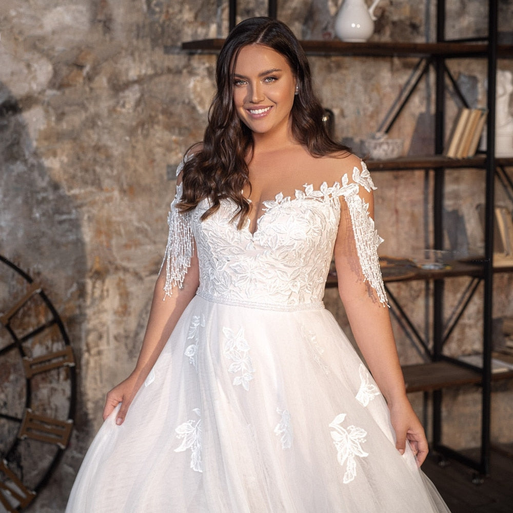 
                      
                        Sheer Neck A-line Bridal Gown Beaded Tassel Cap Sleeve Wedding Dress
                      
                    