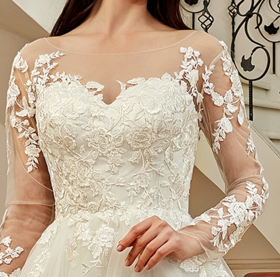 
                      
                        Illusion Long Sleeve Chapel Train Lace Wedding Dress
                      
                    