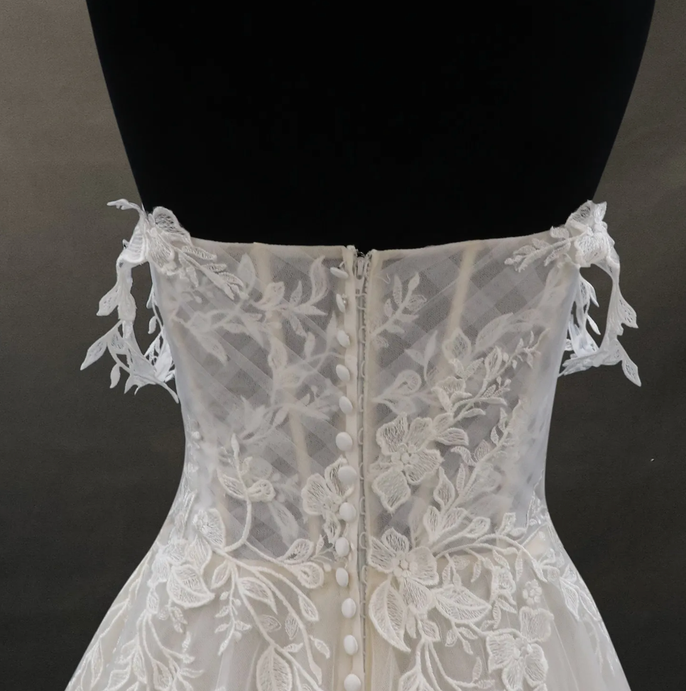 
                      
                        Off-The-Shoulder Lace And Tulle Bridal Gown With Sheer Bodice
                      
                    