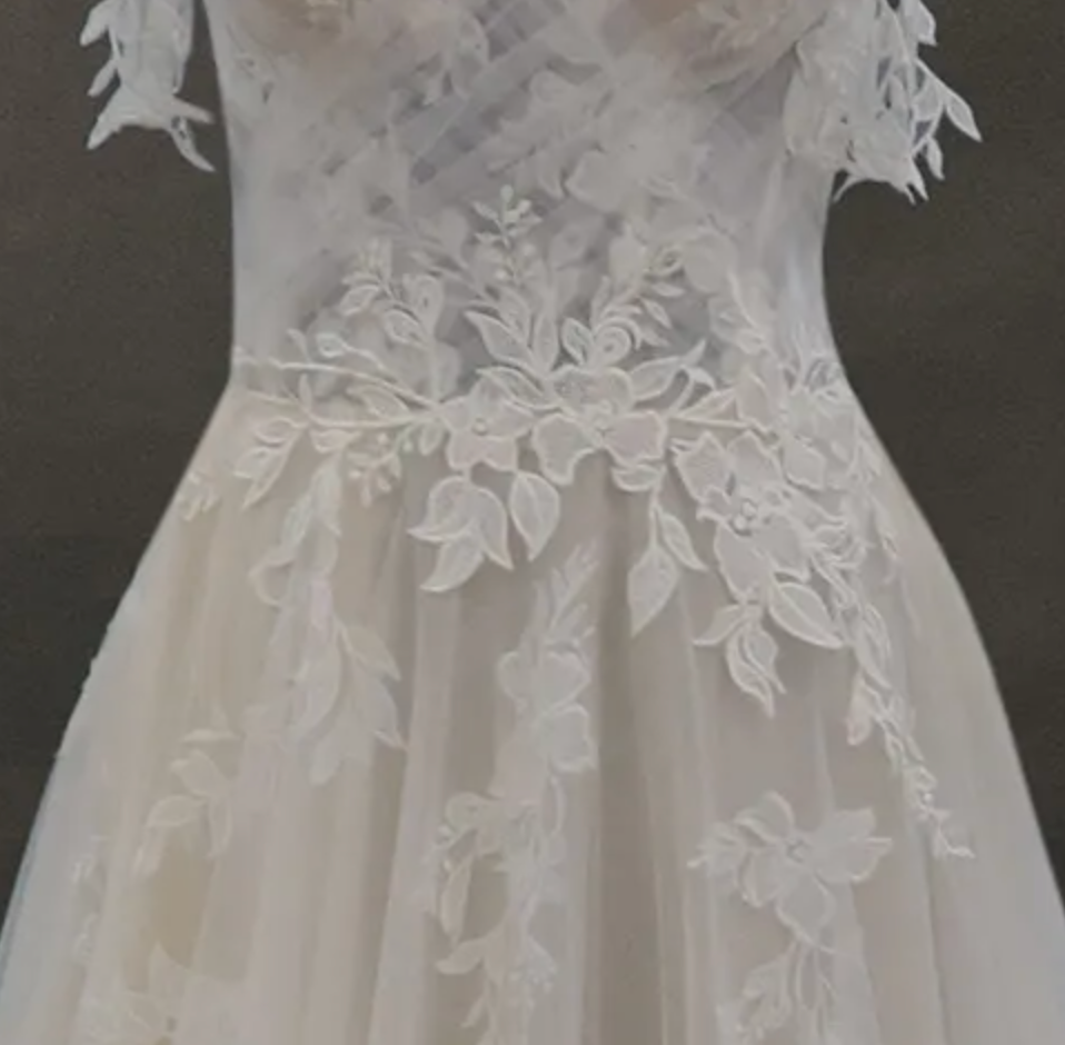 
                      
                        Off-The-Shoulder Lace And Tulle Bridal Gown With Sheer Bodice
                      
                    