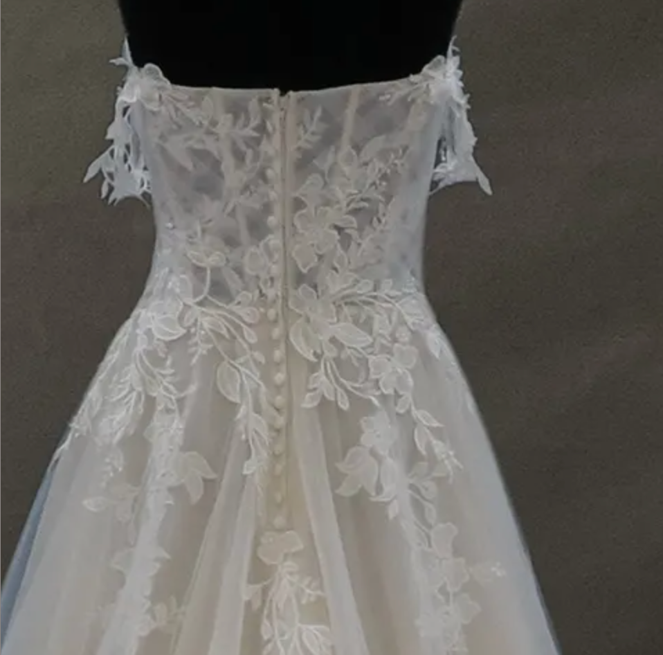 
                      
                        Off-The-Shoulder Lace And Tulle Bridal Gown With Sheer Bodice
                      
                    