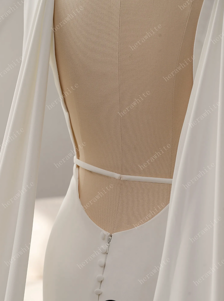 
                      
                        Deep V-Neckline Crepe Wedding Dress with Detachable Cape
                      
                    