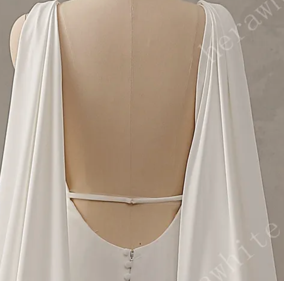 
                      
                        Deep V-Neckline Crepe Wedding Dress with Detachable Cape
                      
                    