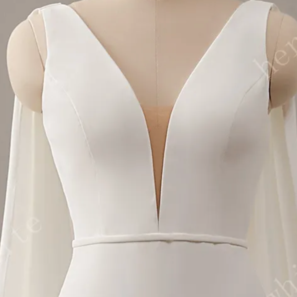 
                      
                        Deep V-Neckline Crepe Wedding Dress with Detachable Cape
                      
                    