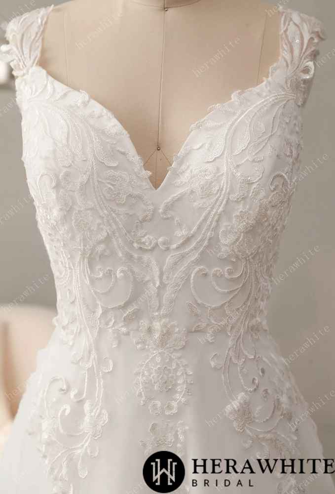
                      
                        Timeless Lace Wedding Dress with V-Neckline
                      
                    