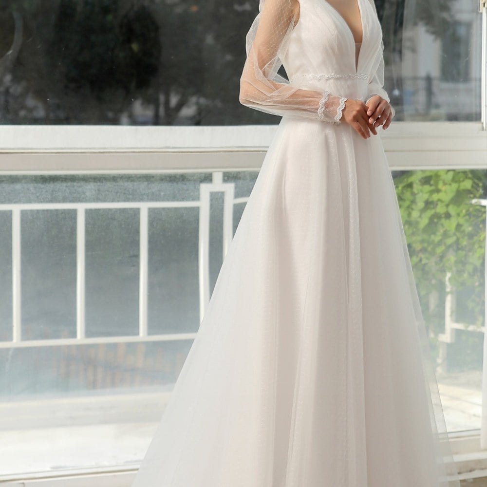 
                      
                        Bishop Long Sleeve Ruched Illusion V-Neckline Bridal Gown
                      
                    