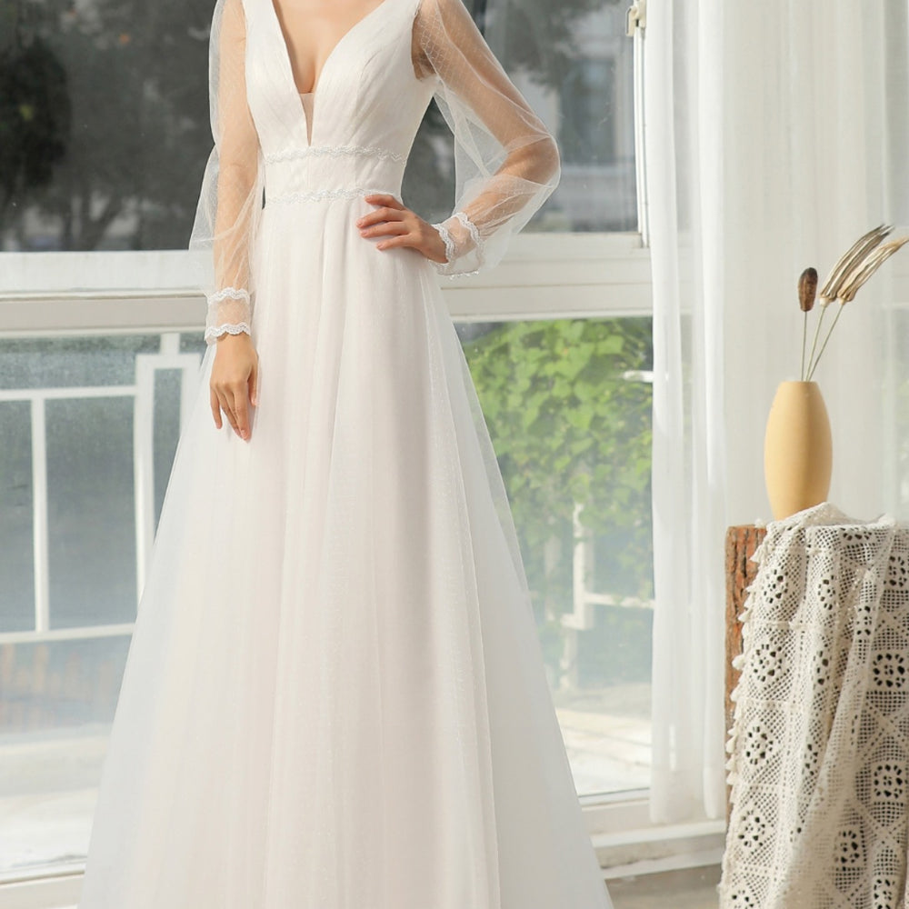 
                      
                        Bishop Long Sleeve Ruched Illusion V-Neckline Bridal Gown
                      
                    