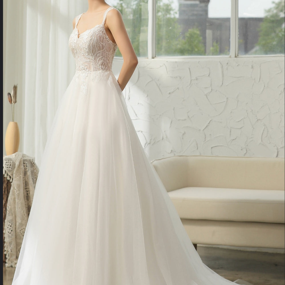 
                      
                        Cap Sleeve Wedding Dress With Glittery Appliqués
                      
                    