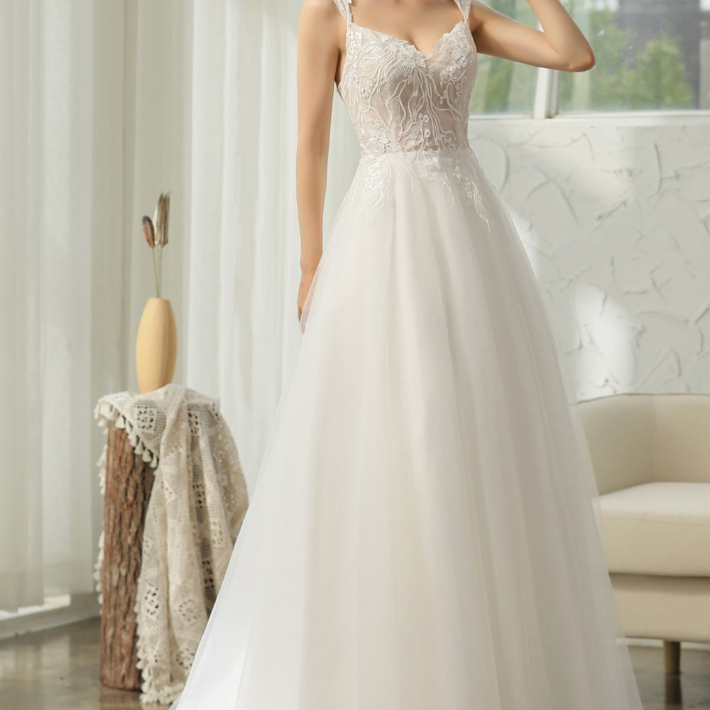 
                      
                        Cap Sleeve Wedding Dress With Glittery Appliqués
                      
                    