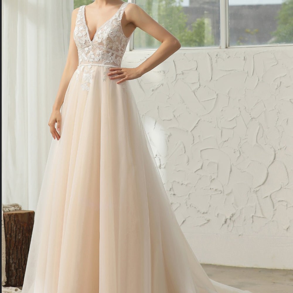 
                      
                        Modern Bohemian Floral Lace Wedding Gown
                      
                    