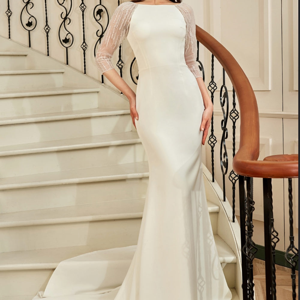 
                      
                        Bateau Neckline Long Train Crepe Bridal Gown With Beaded Illusion Back
                      
                    