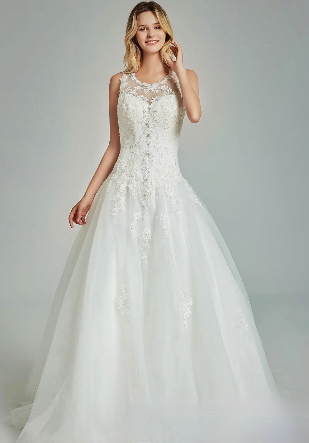 Elegant A-Line Sheer Back Bridal Gown With Appliques