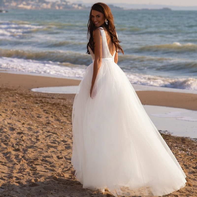 
                      
                        Deep V Sleeveless Bridal Boho Tulle Wedding Gown
                      
                    
