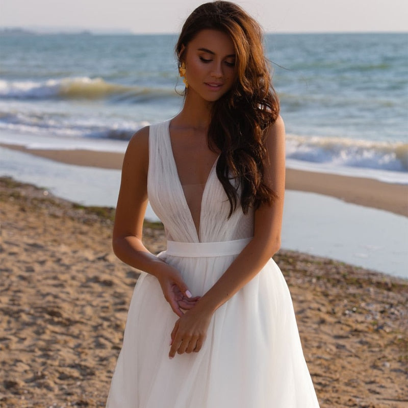 
                      
                        Deep V Sleeveless Bridal Boho Tulle Wedding Gown
                      
                    